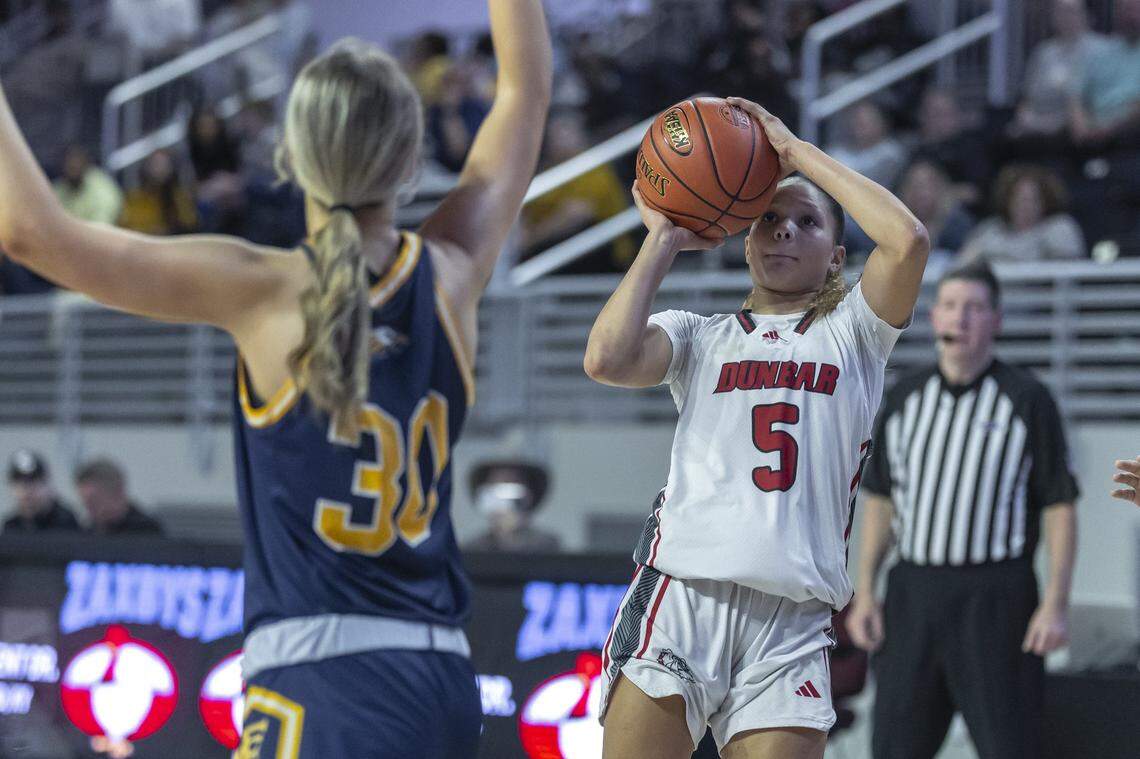 Paul Laurence Dunbar's Kyah Curtsinger shoots the ball as Franklin County's Lynnin Comley defends during the girls 11th Region Tournament semifinals at Eastern Kentucky University's Baptist Health Arena in Richmond, Ky., on Friday, March 6, 2026.