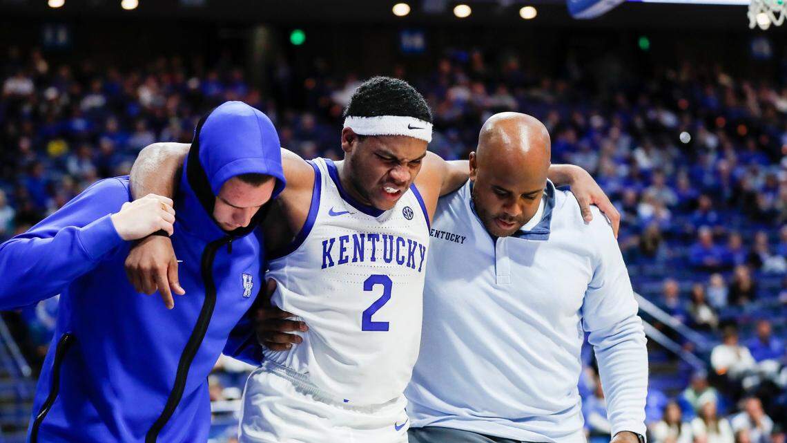 Kentucky guard Sahvir Wheeler is helped off the court after an injury in the second half of the game with Missouri Western State at Rupp Arena on Sunday.