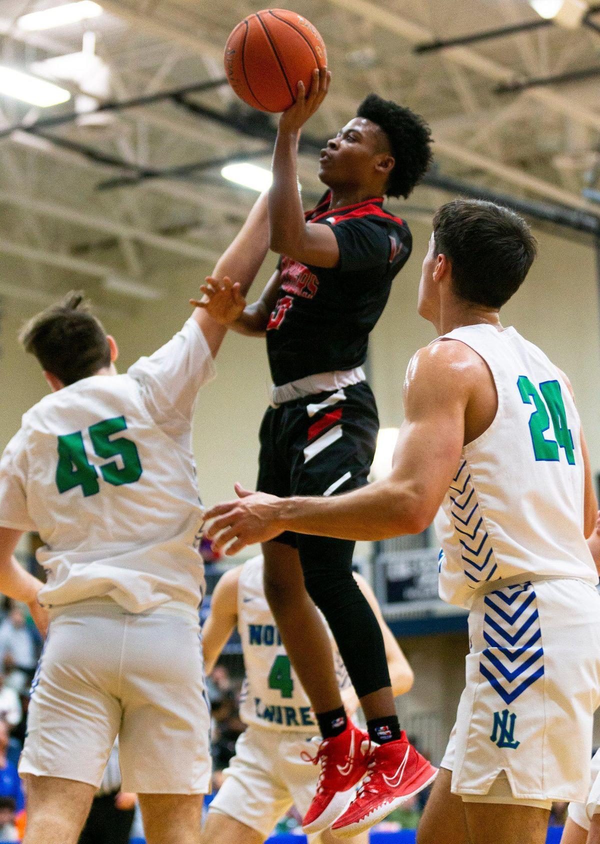 Pleasure Ridge Park’s Zee McCown (13) scored 39 points during Monday night’s quarterfinals loss to North Laurel.