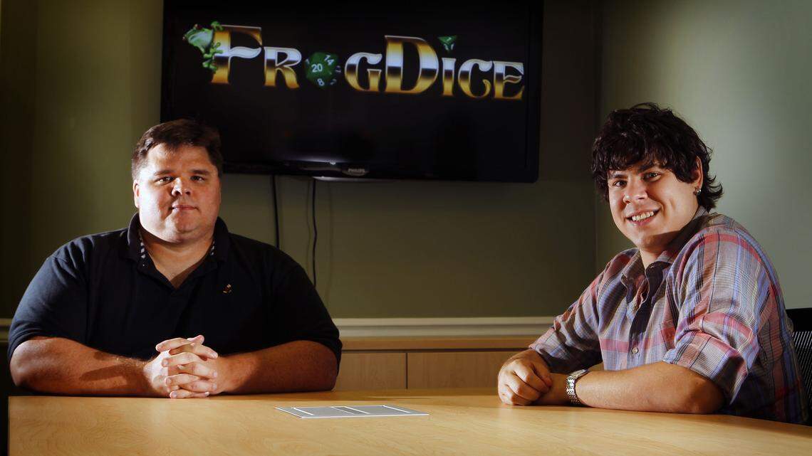 Frogdice president and CEO Michael Hartman, left, recently hired artist Adam Sullivan to work for the company full-time. 