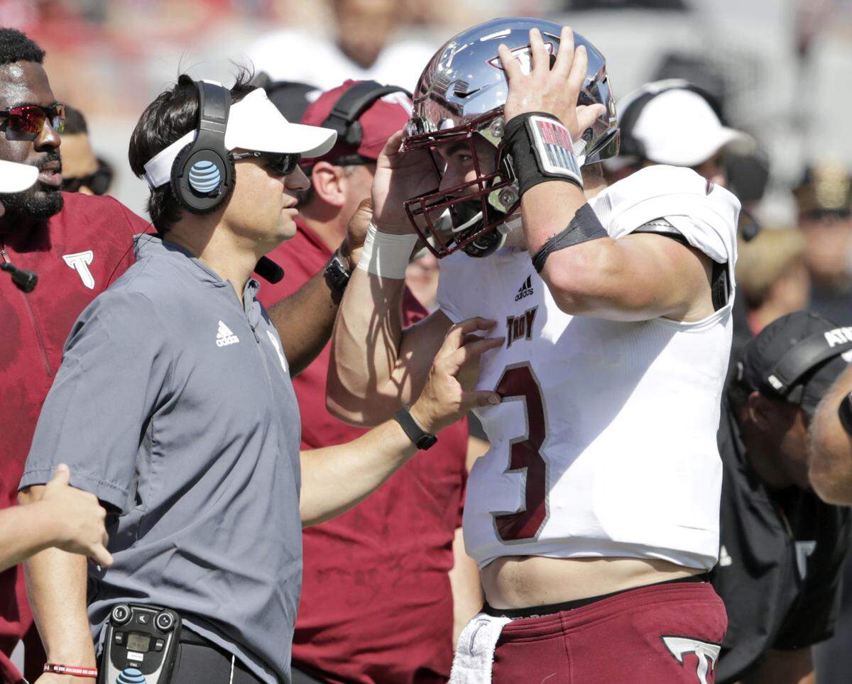 New UK QB Sawyer Smith, right, played for former Kentucky player and assistant coach Neal Brown at Troy last season. Brown is now the head coach at West Virginia.