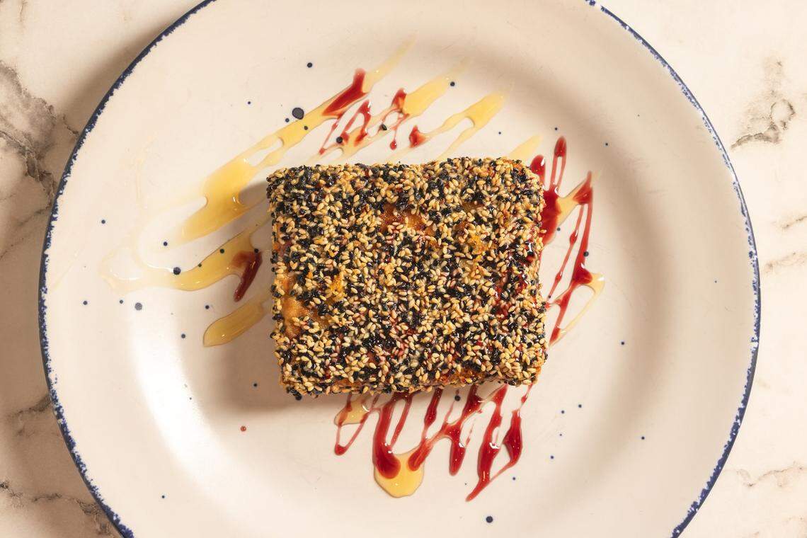 Athenian Grill will open a new sit-down restaurant near Fayette Mall instead of opening an upscale Greek place called Santorini. The new Athenian Grill will include a larger menu with items such as baked feta in phyllo dough with sesame seeds.