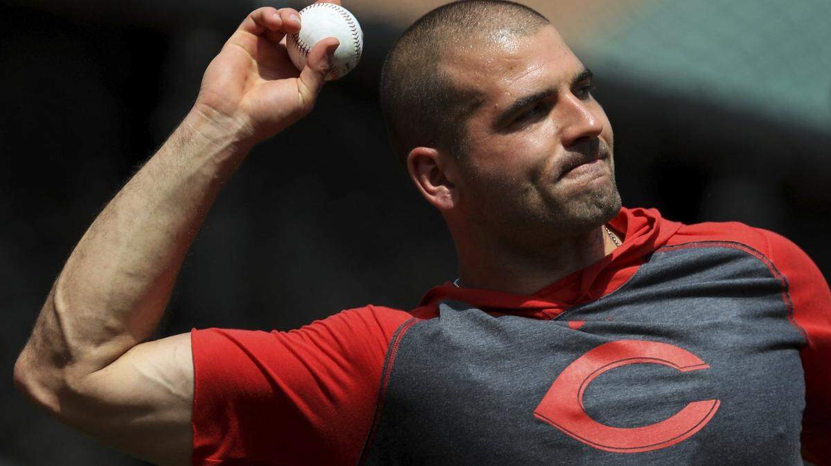Cincinnati Reds’ Joey Votto (19) throws during team baseball practice at Great American Ballpark in Cincinnati, Friday, July 3, 2020. (AP Photo/Aaron Doster)
