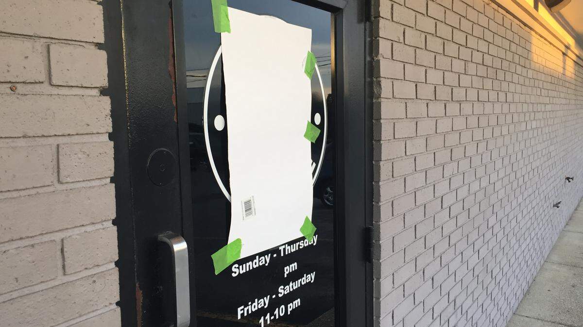 Paper covered the logo on the door of the Napa Prime restaurant in Versailles. Owner Darrell Lewis closed it abruptly at the end of July.