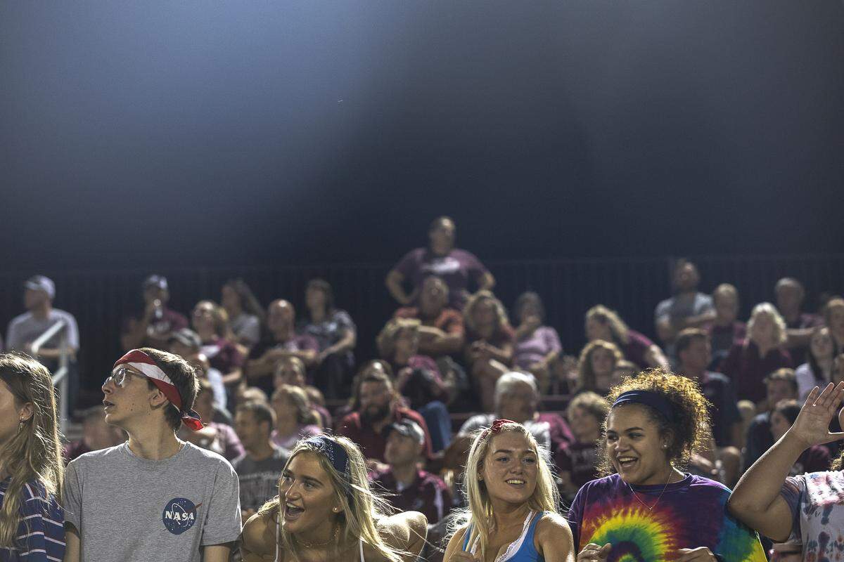 Members of the Pikeville student section cheer during the game Friday night.