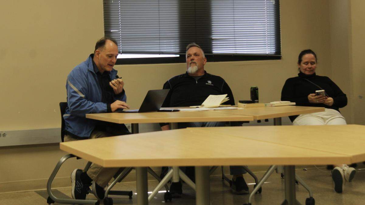 University of Kentucky Faculty Senate Chair Chris Crawford (left) speaks at a faculty senate meeting on May 4, 2026.