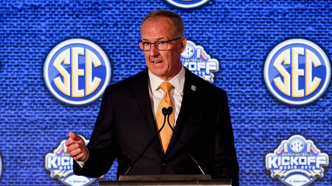 SEC Commissioner Greg Sankey speaks to reporters during Southeastern Conference Media Days on Monday in Hoover, Ala. Sankey suggested teams might have to forfeit games this fall if they’re not healthy enough to play.