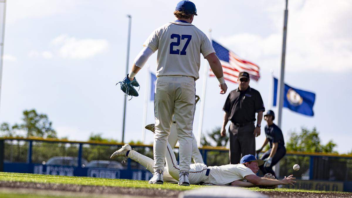 Henry Clay’s Brayden Brand loses the ball as he falls to the ground trying to make a play on a pop fly in the infield during the 11th Region Baseball Tournament semifinals at Legends Field on Wednesday.
