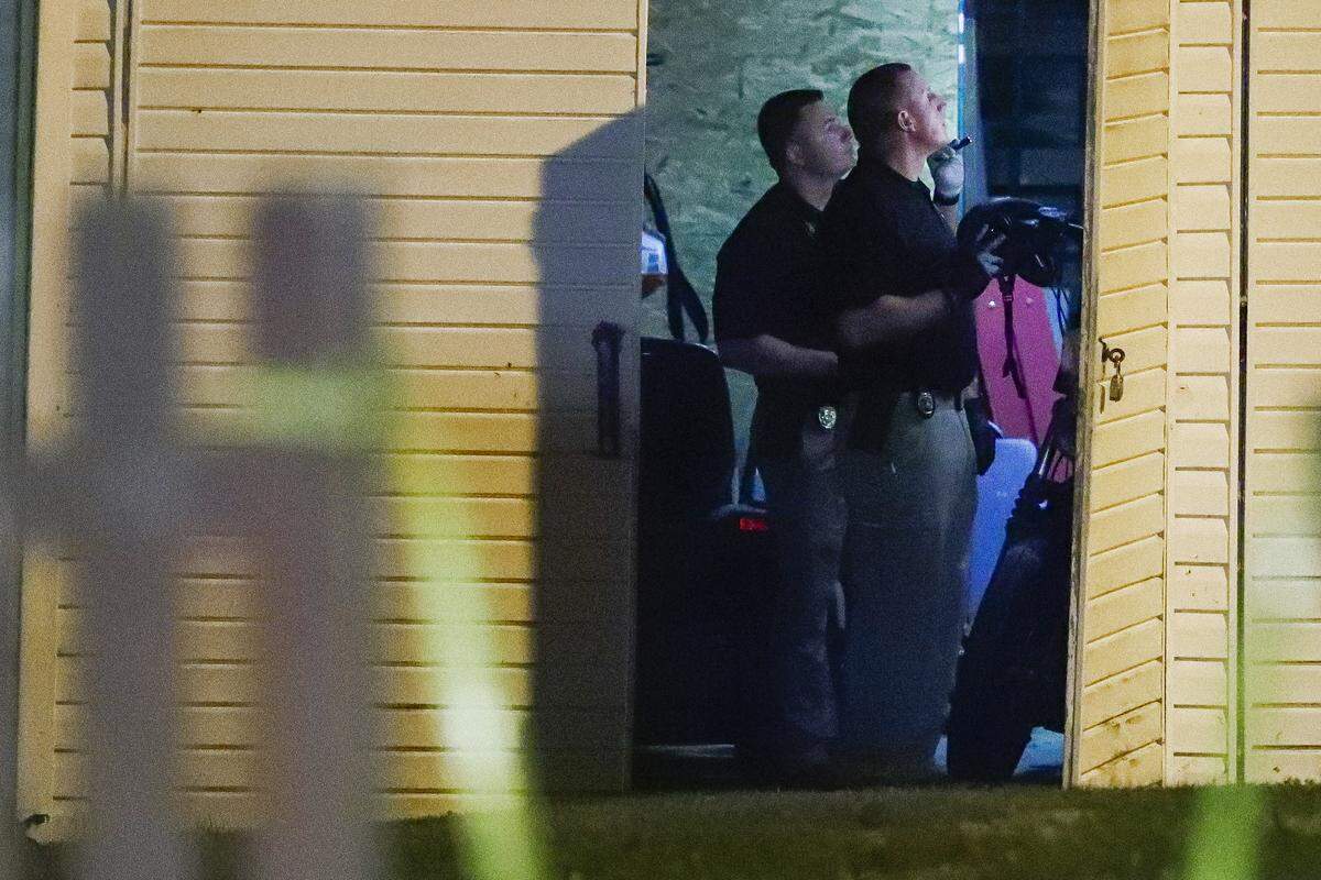 Investigators search a garage for the remains of Savannah Spurlock at a home on Fall Lick Road in Garrard County, Ky., Wednesday, July 10, 2019. Spurlock has been missing since early January.