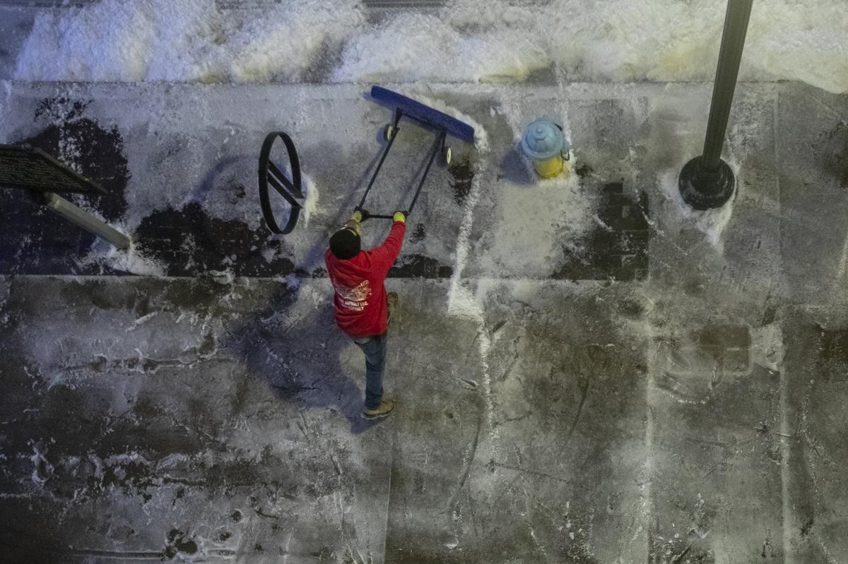 A winter storm leaves snow and ice on the streets and sidewalks of Lexington, Ky. on Thursday, Feb. 11, 2021. The city asked residents to stay off the roads as much as possible.