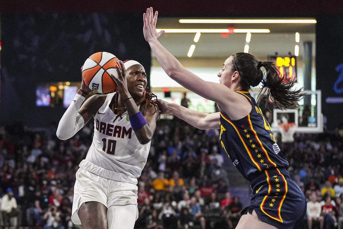 May 10, 2025; Atlanta, GA, USA; Atlanta Dream guard Rhyne Howard (10) is defended by Indiana Fever guard Caitlin Clark (22) during the first half at Gateway Center Arena @ College Park. Mandatory Credit: Dale Zanine-Imagn Images