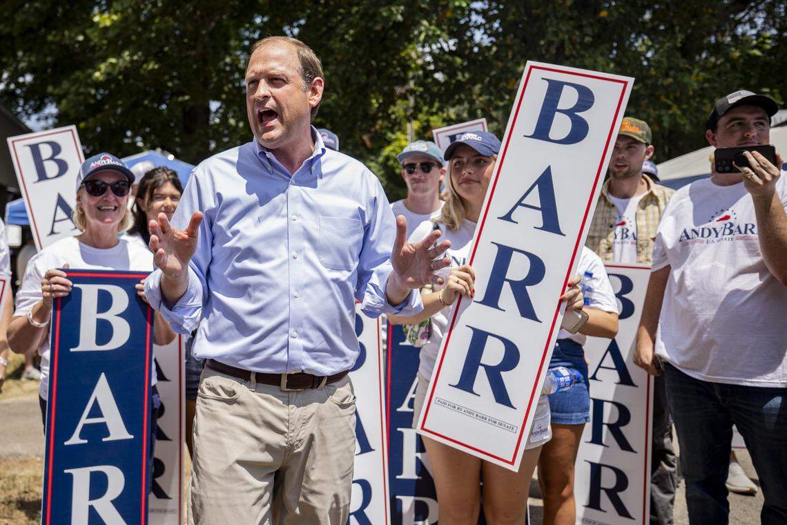 Andy Barr, center, talks to his supporters during Fancy Farm Picnic on Saturday, Aug. 2, 2025, at St. Jerome Church in Fancy Farm, Ky.
