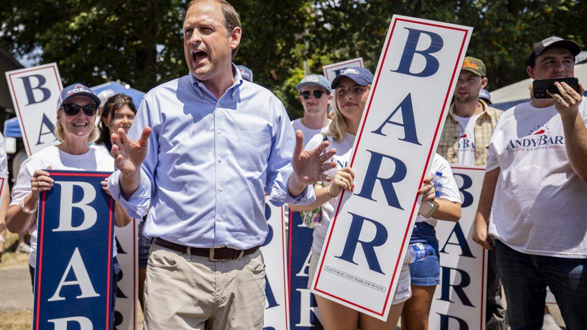 Andy Barr, center, talks to his supporters during Fancy Farm Picnic on Saturday, Aug. 2, 2025, at St. Jerome Church in Fancy Farm, Ky.