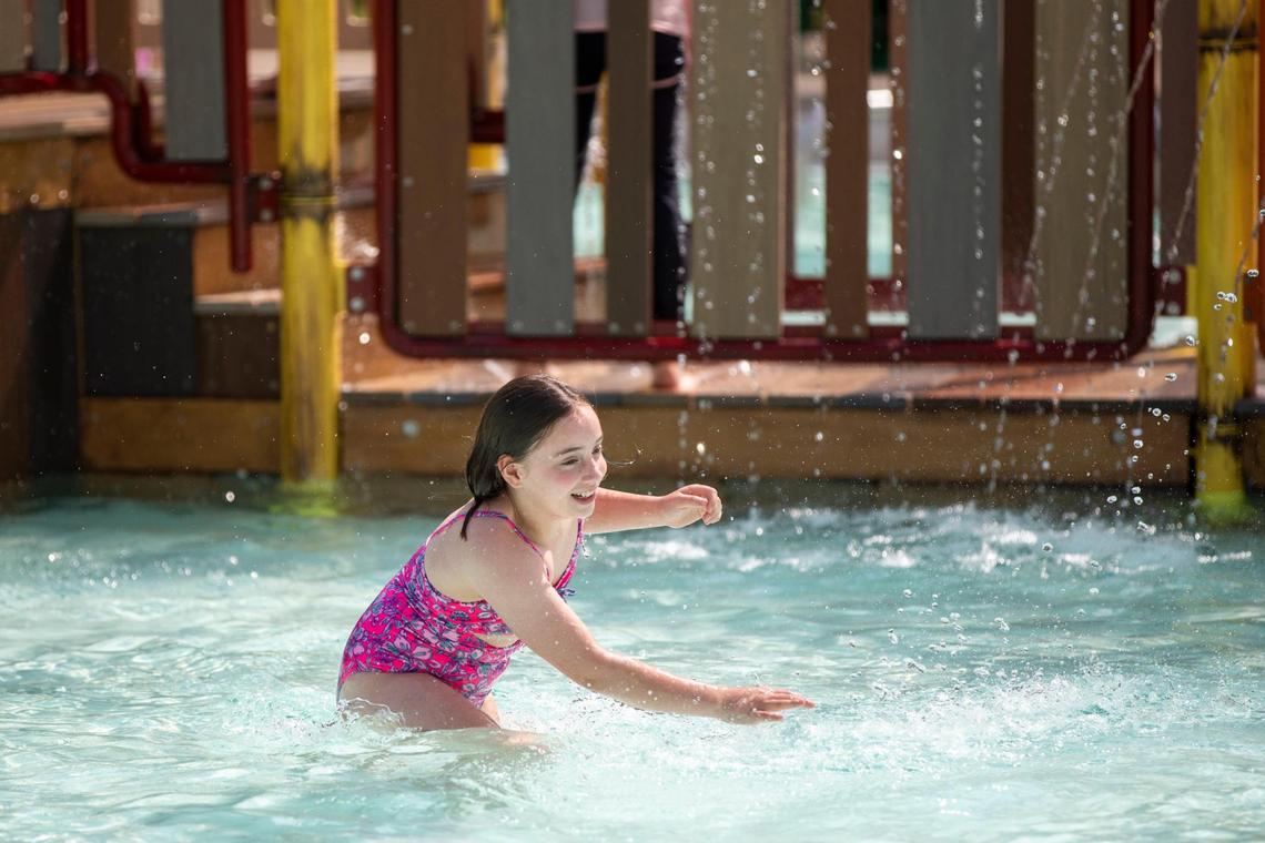 Children play on and near the newest pool feature at the Woodland Aquatic Center: Paradise Lagoon, a shipwreck-themed feature at Woodland Aquatic Center at Woodland Park in Lexington, Ky., Friday, May 26, 2023.