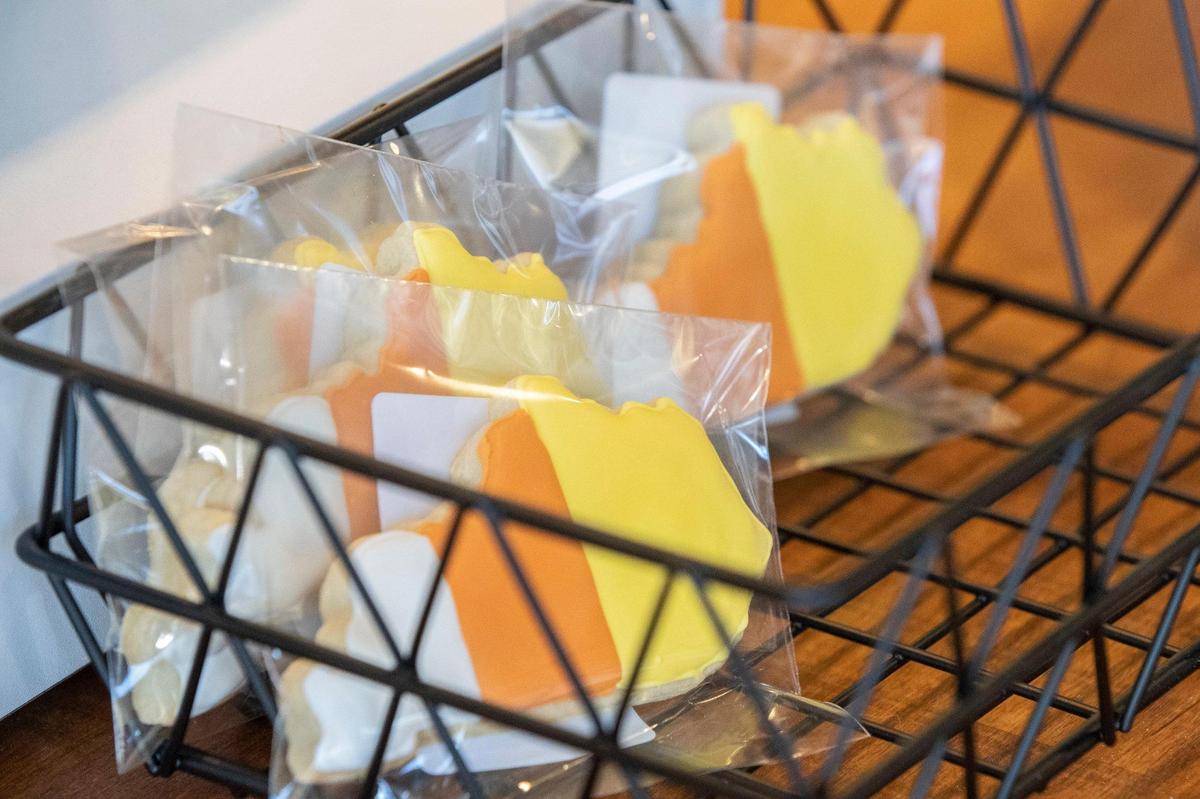 Daniel King makes custom-decorated sugar cookies, including seasonal Kentucky-shaped ones, like these with candy corn-colored icing.