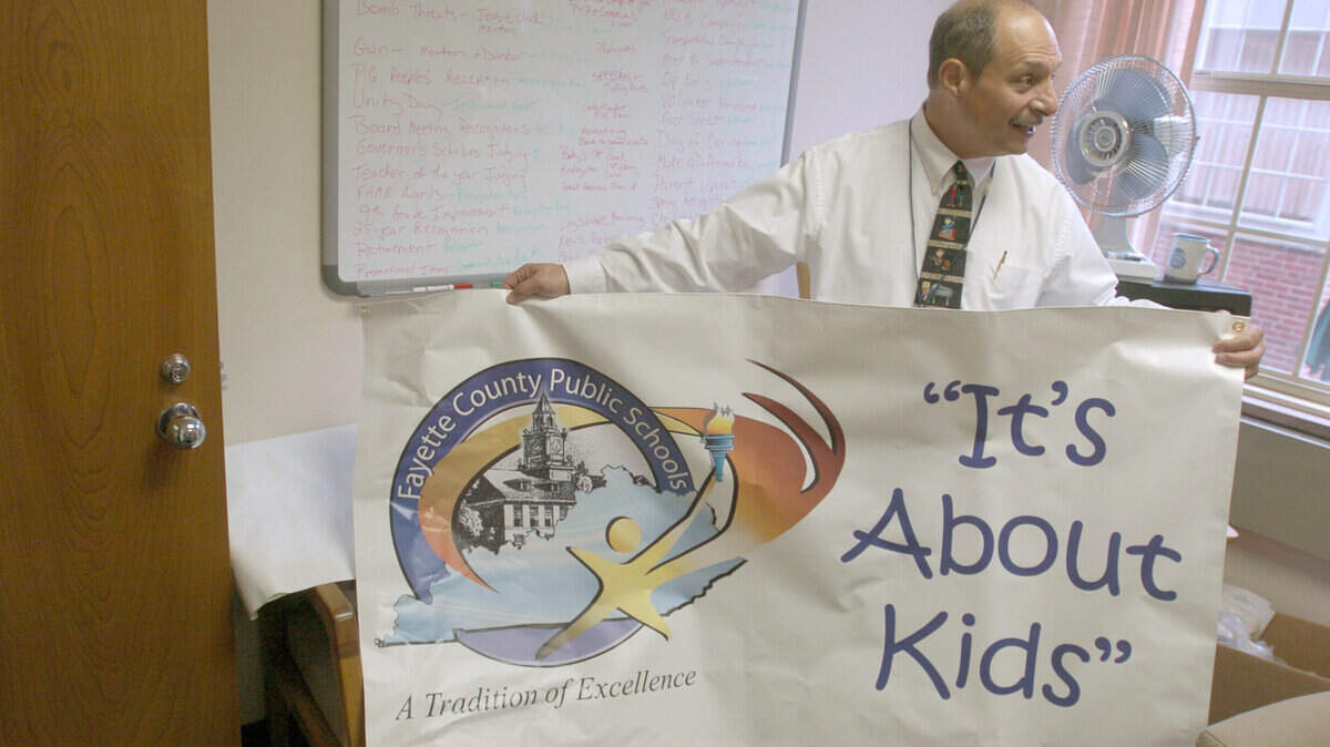        Silberman displayed a banner with his motto in the Central Office during his first day on the job as superintendent in 2004.
