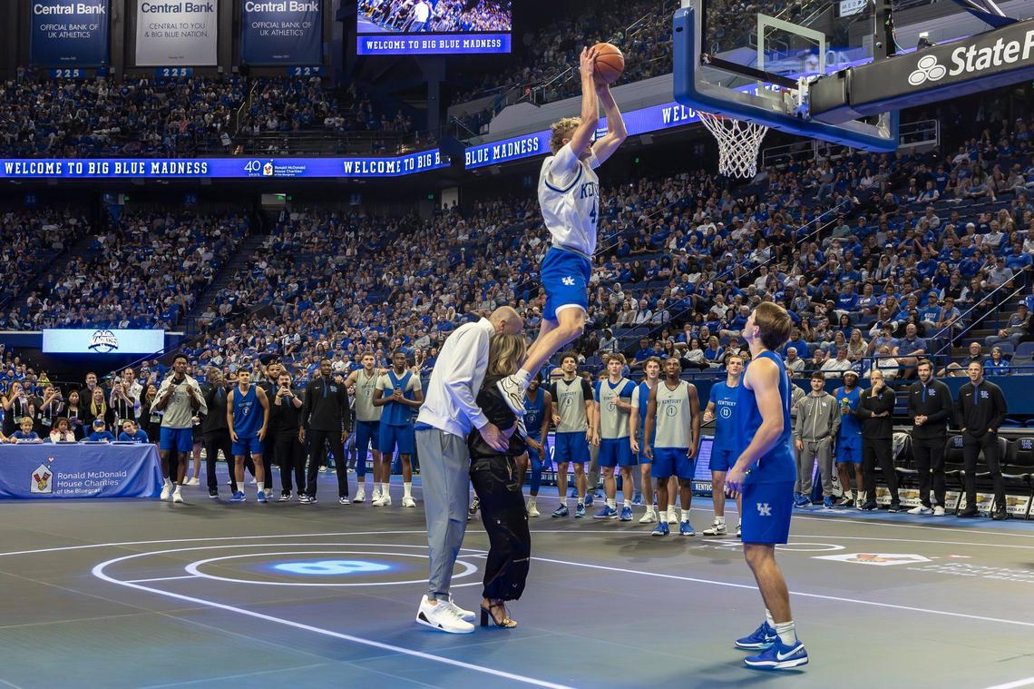 Collin Chandler won the dunk contest by throwing down over head coach Mark Pope and his wife, Lee Anne, during Big Blue Madness.