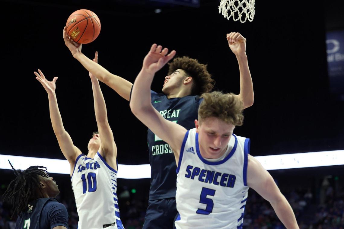Great Crossing’s Malachi Moreno pulls in a rebound between Spencer County’s Keaton Baird (10) and Luke Erhardt (5) during Wednesday night’s first-round game in Rupp Arena. Spencer County coach Jason Burns knew the Warhawks’ height would be a problem. “We told them to eat their green beans this week, but you can’t grow 6 inches in a week.”