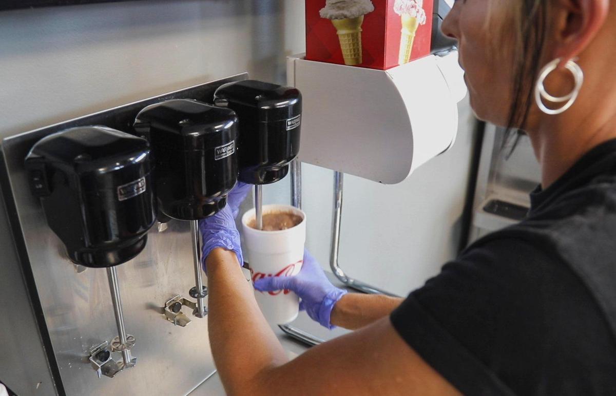 Assistant manager Laken Burchett prepares a milkshake. Marshmallow Cokes is another popular drink, made with marshmallow fluff.