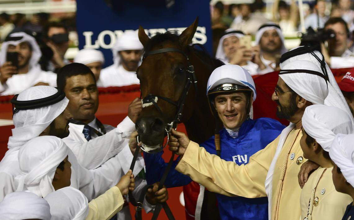 UAE Prime Minister and Dubai Ruler Sheikh Mohammed bin Rashid al Maktoum held Thunder Snow's reins next to jockey Christophe Soumillon after victory in the $10 million Dubai World Cup in Dubai, the United Arab Emirates in March. Al Maktoum will bring Enticed from his Godolphin stable to the Kentucky Derby this year.