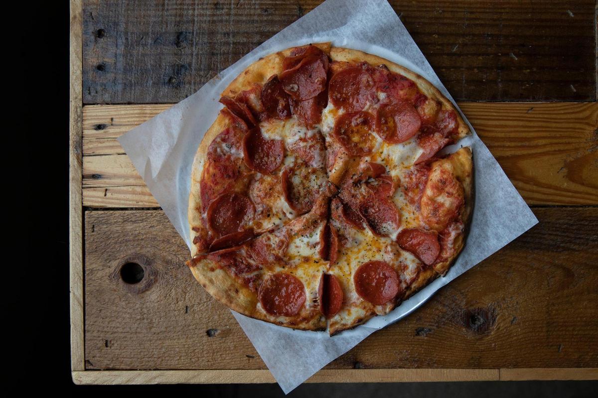 A pepperoni pizza from Rolling Oven, located at Mirror Twin Brewing Co.