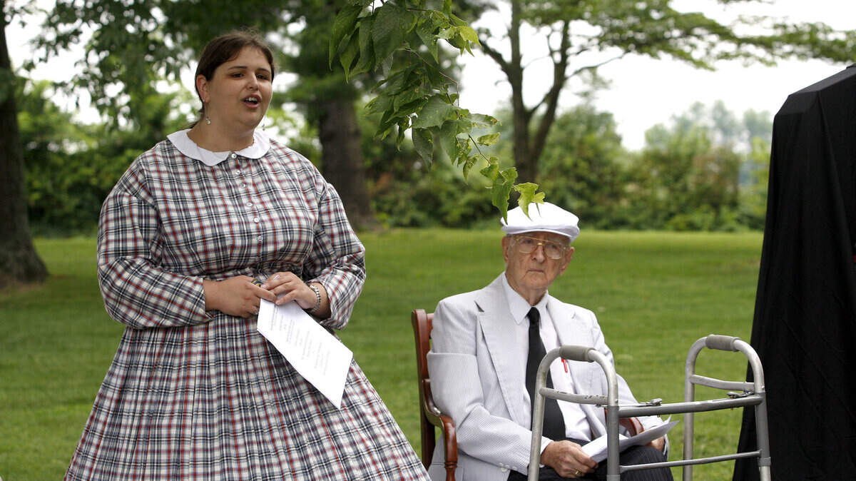 Wearing period attire, Kristyn Amsler sang  Waveland, My Waveland during the  monument dedication.  