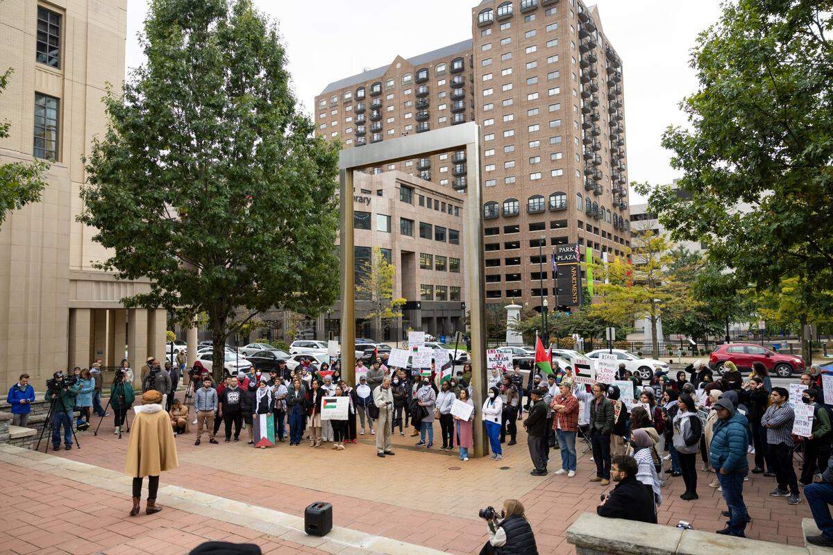 A crowd gathered at the End the Genocide in Gaza rally Tuesday night at the courthouse plaza in Lexington.