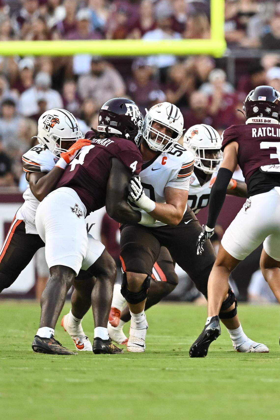 Sep 21, 2024; College Station, Texas, USA; Bowling Green Falcons offensive tackle Alex Wollschlaeger (50) blocks against Texas A&M Aggies defensive lineman Shemar Stewart (4) during the first quarter at Kyle Field. Mandatory Credit: Maria Lysaker-Imagn Images. 