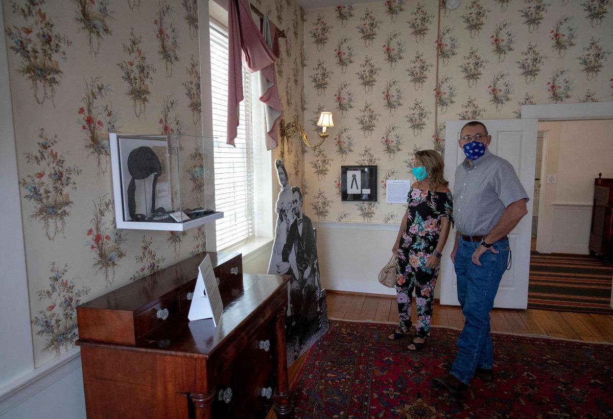 Camilla and Rusty Nolan take a self-guided tour at the Mary Todd Lincoln House in Lexington, Ky., Wednesday, August, 2020. The Nolans are from Clay City and were taking a day off to enjoy Lexington. The Mary Todd Lincoln House recently converted to self-guided tours to ensure safety of visitors during the coronavirus pandemic.