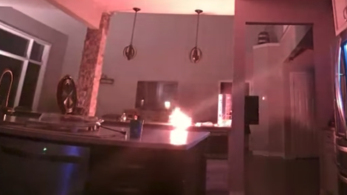 An iPhone 4 caught fire as it was charging inside an Ohio home, video shows.