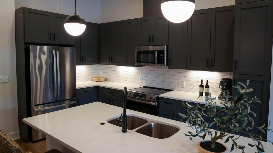 The kitchens in the new apartments at The Landing at Lakewood Harbour, shown Thursday, May 29, 2025 in Lexington, Ky., come with GE stainless steel appliances. There are 101 high-end, one- and two-bedroom apartments in the development.