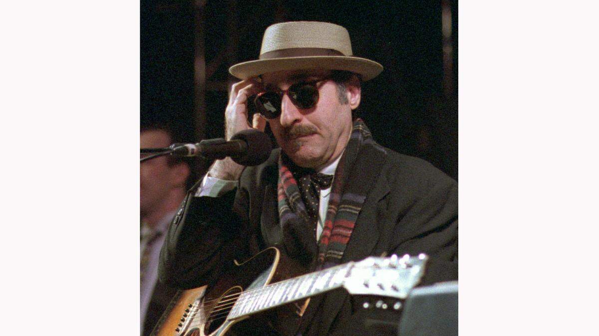 This March 28, 1998 file photo shows Leon Redbone performing at the eighth annual Redwood Coast Dixieland Jazz Festival in Eureka, Calif. Redbone, the acclaimed singer and guitarist who performed jazz, ragtime and Tin Pan Alley-styled songs, died Thursday, May 30, 2019, according to a statement released by his family. No details about his death were provided.