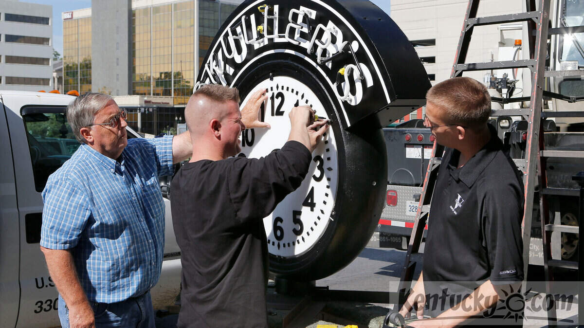 Rocky Sebastian, left, owner of Sebastian Sign and Crane Co., and Casey McCracken and Tommy Verdin, both with the Verdin Co., worked on the dial as they reinstalled the Skuller's clock Tuesday in the 100 block of West Main Street in downtown Lexington. The cast-iron clock, which is about 14 feet tall, was taken down in 2010 and stored until money was raised for the complete restoration by the Verdin Co. of Cincinnati. Skuller's used to sell eyeglasses in addition to jewelry, and the restored clock will include a set of eyes similar to the eyes on the original clock. The new workings include an atomic clock with a 10-year backup battery to assure accurate time. 