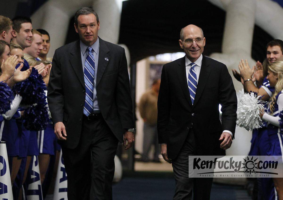 In acknowledging a pay increase for UK Athletics Director Mitch Barnhart, left, UK President Eli Capilouto, right, said, “Now, more than ever, a sense of stability, continuity and absolute trust in leadership is essential in college athletics.”