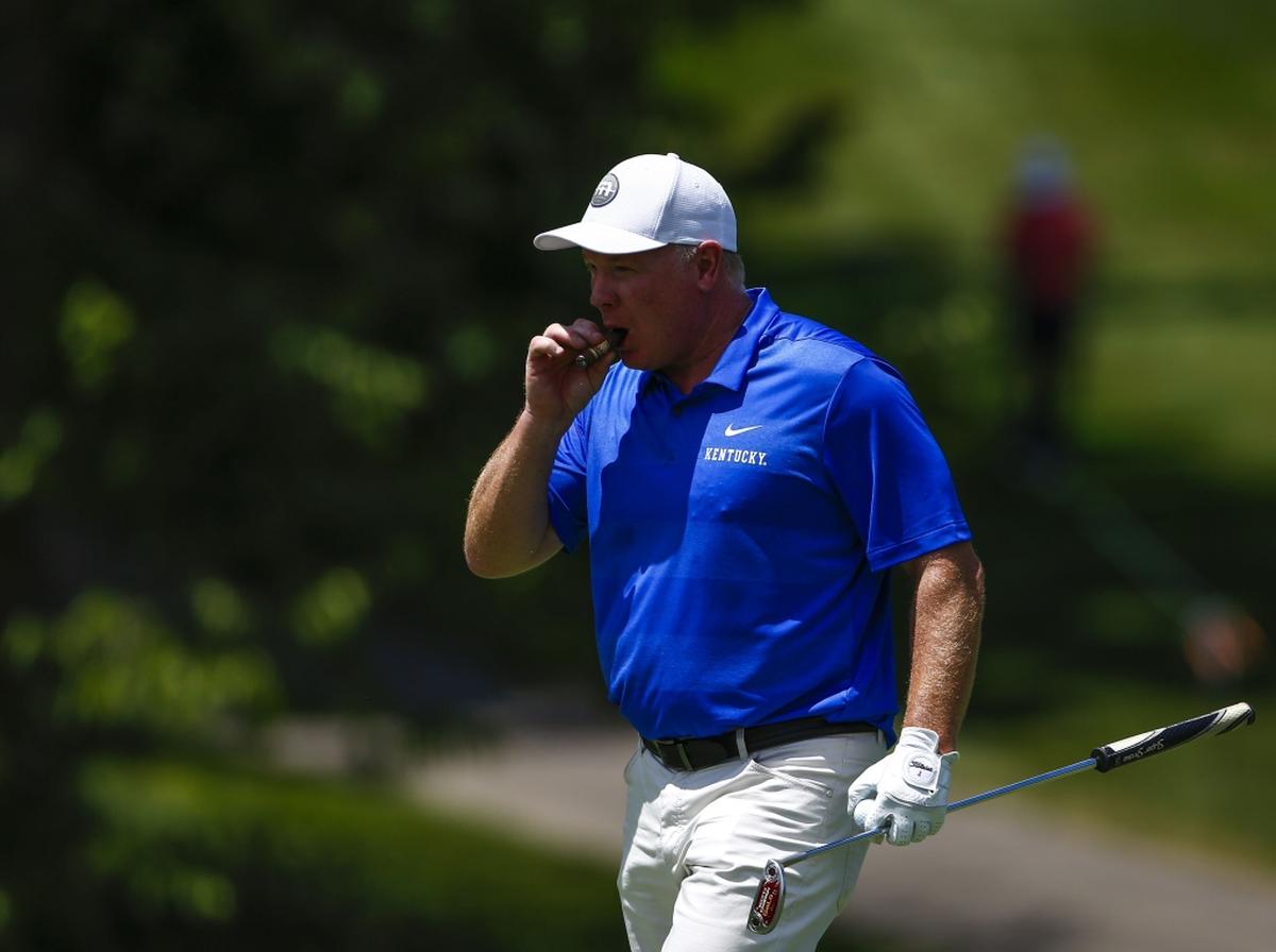 University of Kentucky head football coach Mark Stoops smoked a cigar during Wednesday’s Pro-Am event at the PGA Tour Barbasol Championship at Keene Trace Golf Club outside Nicholasville.