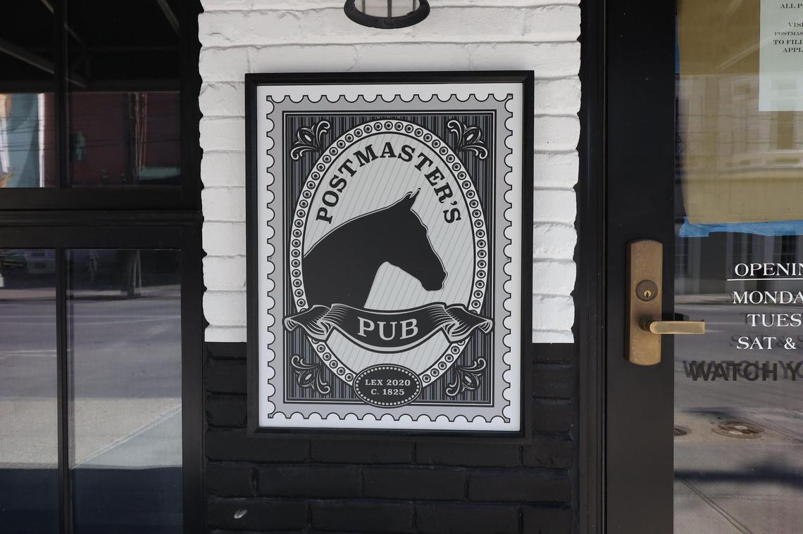 Postmaster’s Pub sign on West Short St.