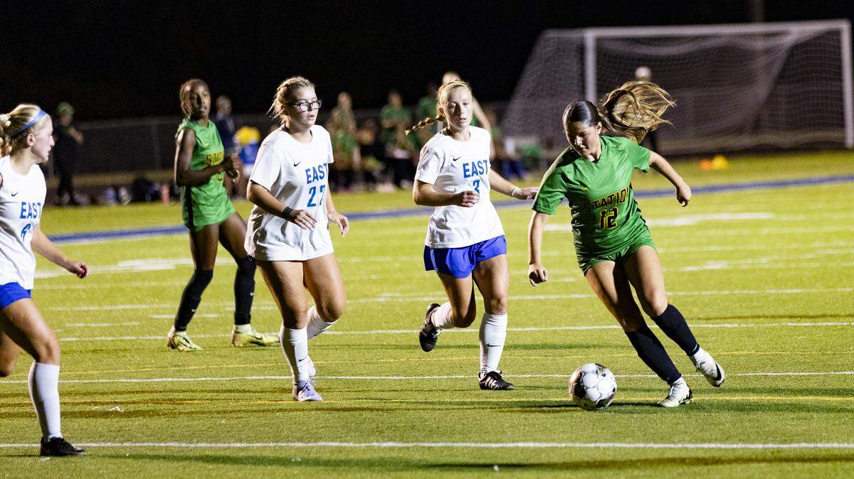 Bryan Station’s Fabianna Herrera (12) made a move on her East Jessamine defenders before firing a shot on goal to put the Defenders up 3-0 in the second half at Bryan Station High School on Wednesday.