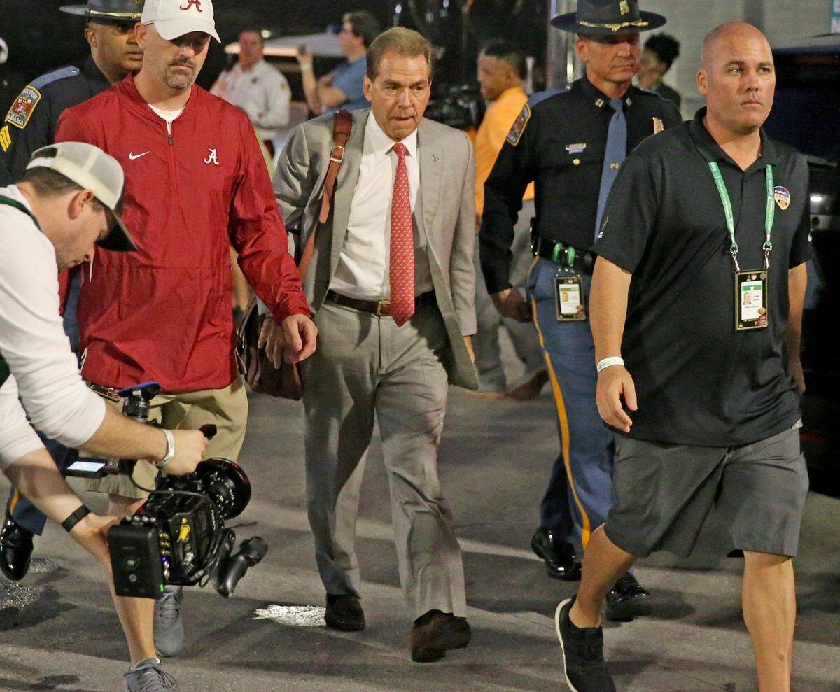 Alabama’s Coach Nick Saban, center, will bring the Crimson Tide to Lexington on Nov. 11 for a potential cold-weather meeting with the Kentucky Wildcats.