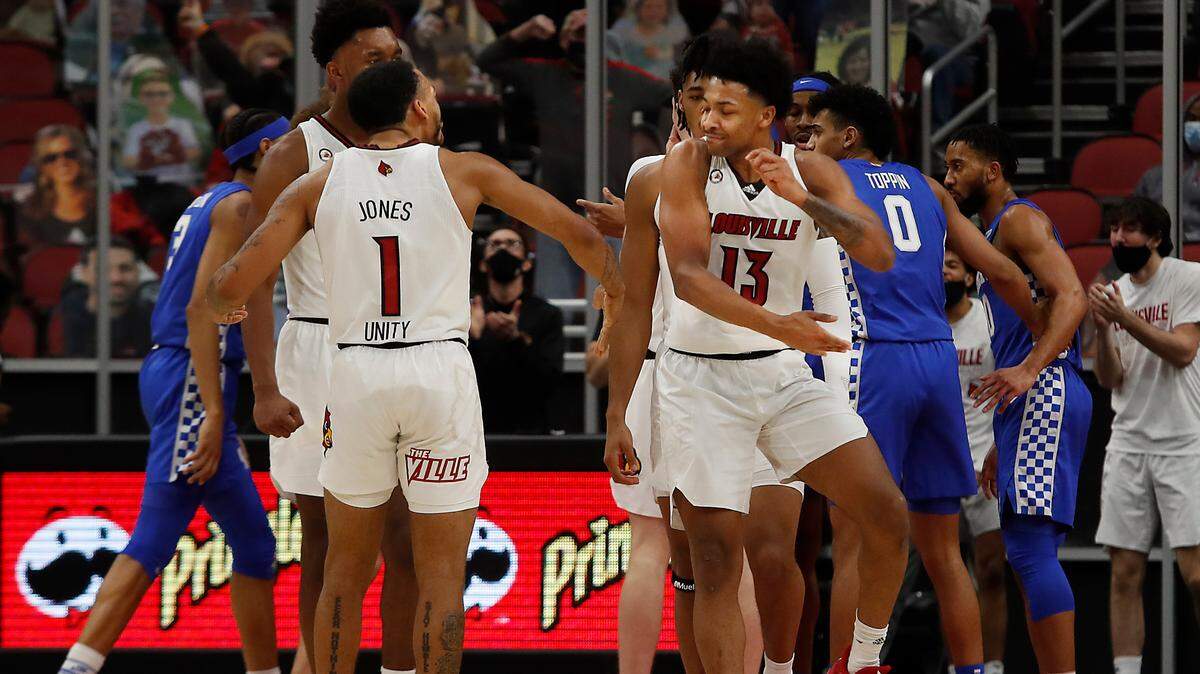 Louisville’s Carlik Jones and David Johnson celebrated during the Cardinals’ win over Kentucky in December. U of L finds itself at a March Madness tipping point entering the regular season’s final two games.