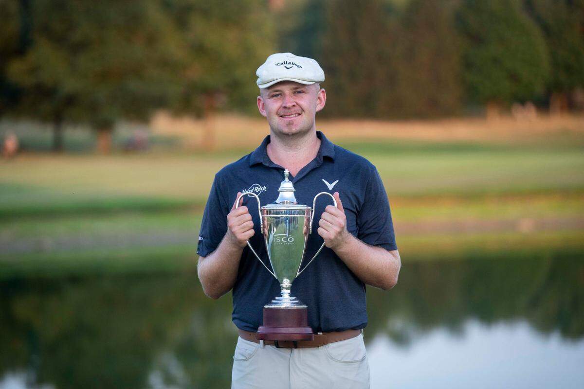 Harry Hall holds the ISCO Championship trophy after winning a five-man playoff for the tournament title following Sunday’s final round at Keene Trace Golf Club in Nicholasville. Hall recorded his first PGA Tour win in his 58th Tour start.
