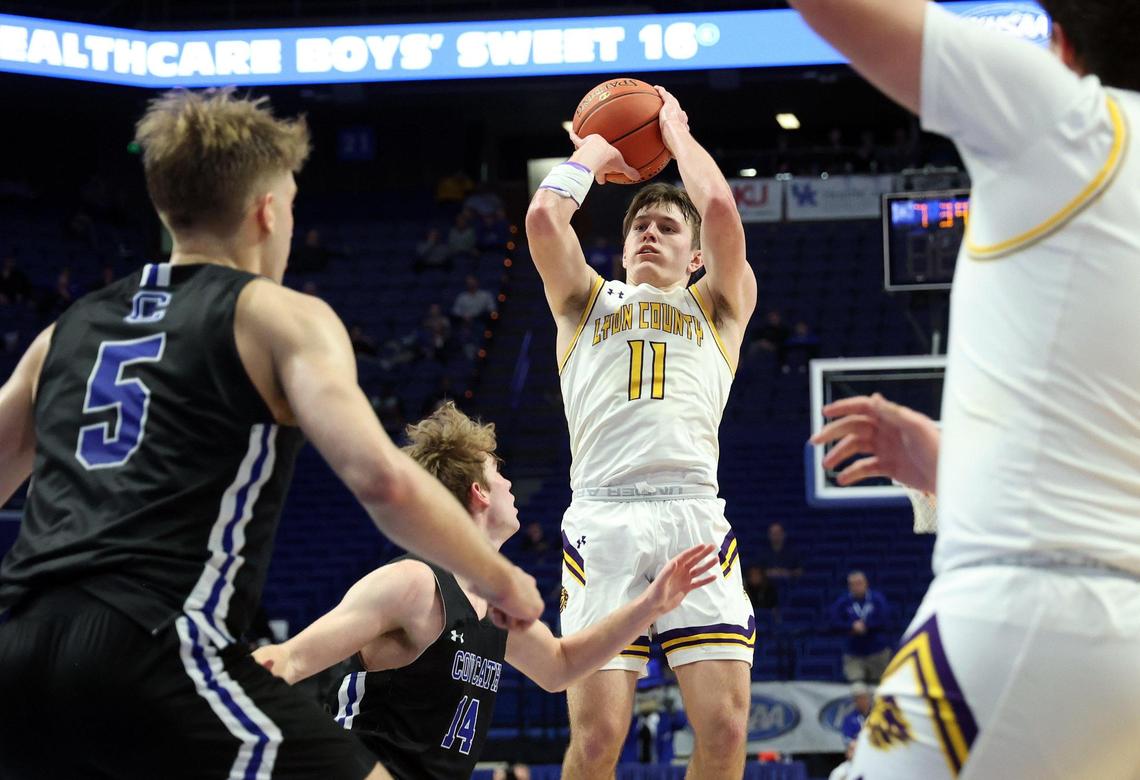 Lyon County’s Travis Perry (11) shoots over the Covington Catholic defense during the UK HealthCare Boys’ Sweet 16 in Rupp Arena on March 18.