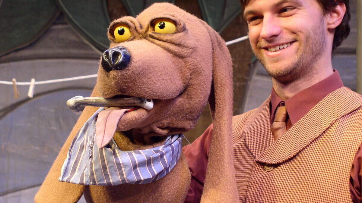 Michael Whitten plays Shoestring the hound dog, Old Jake's companion, in Lexington Children's Theatre's production.      