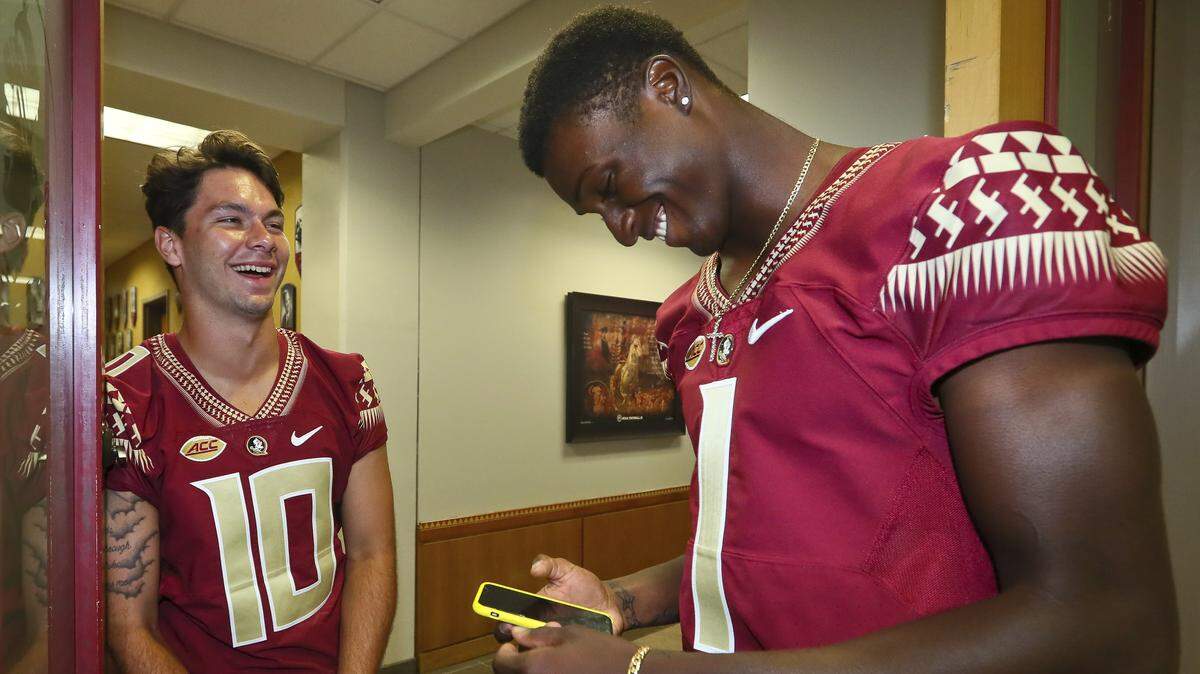 Florida State quarterbacks Bailey Hockman (10) and James Blackman (1) shared a laugh after interviews concluded at team’s media day Sunday, Aug. 19, 2018, in Tallahassee, Fla.
