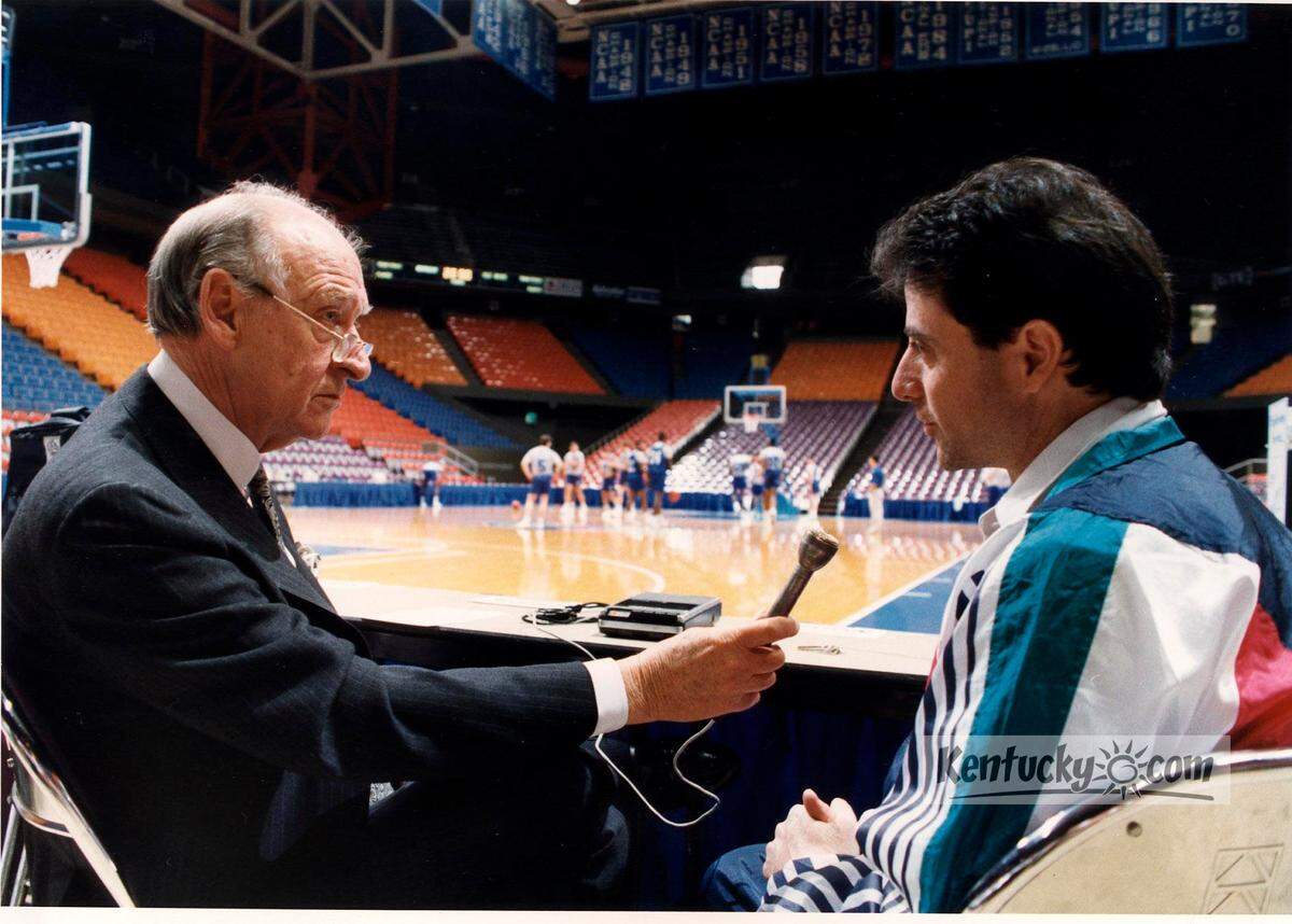 Iconic University of Kentucky radio play-by-play announcer Cawood Ledford, left, interviewed then-Wildcats head coach Rick Pitino in Rupp Arena during the 1991-92 season, Ledford’s final season calling the Cats.