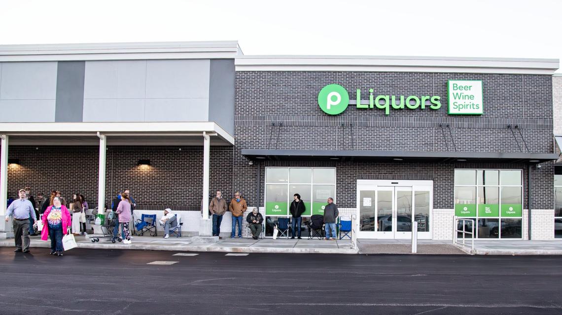 New customers stand in a line waiting for the Publix Liquors open hours on March 5, 2025 in Lexington, Ky.