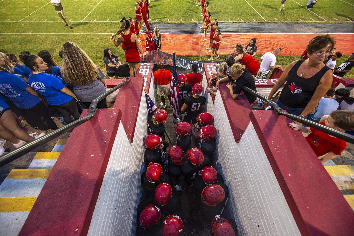 The Mayfield Cardinals wait to take the field.