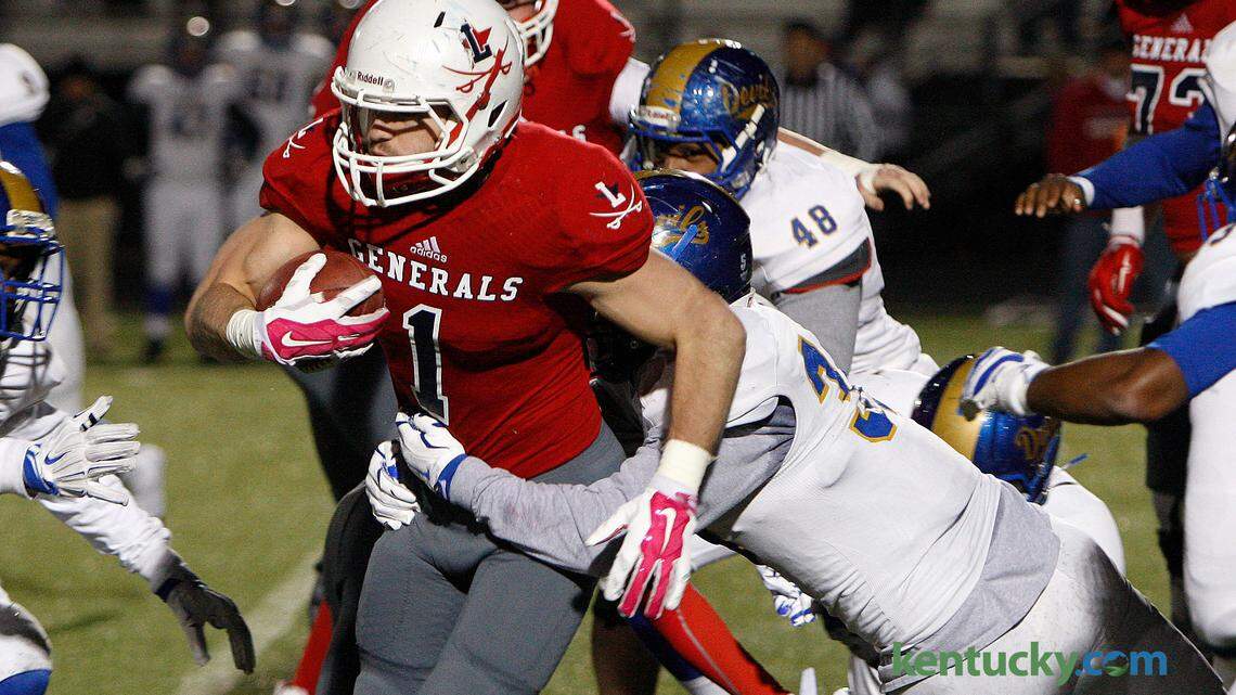 Lafayette's Mason Alstatt breaks a tackle against Henry Clay during the playoff matchup at Ishmael Stadium in Lexington, Ky., Friday, November 13, 2015. Photo by Matt Goins