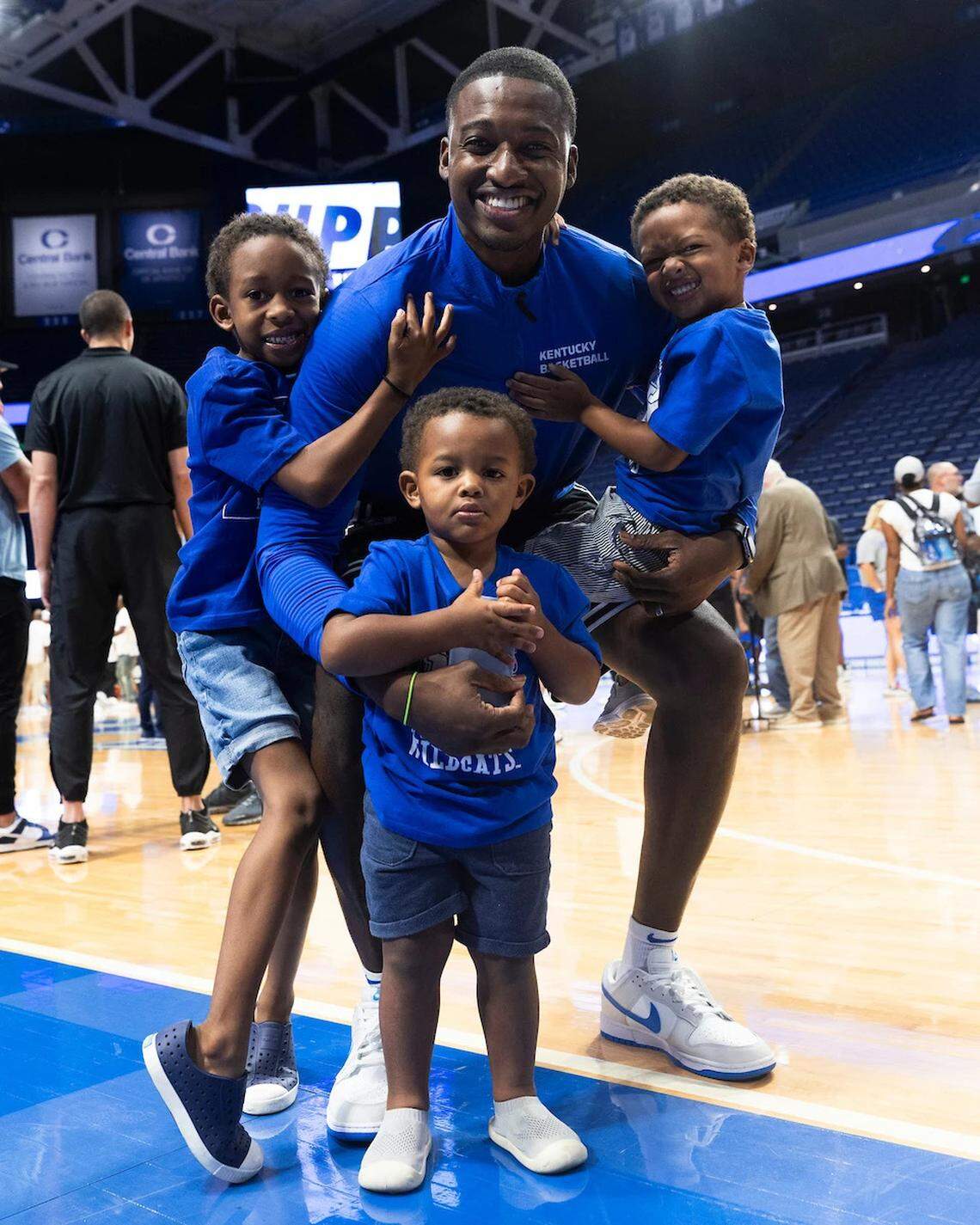 Kentucky assistant coach Mikhail McLean and his three sons, Mikhail Jr., Amari and Kai.