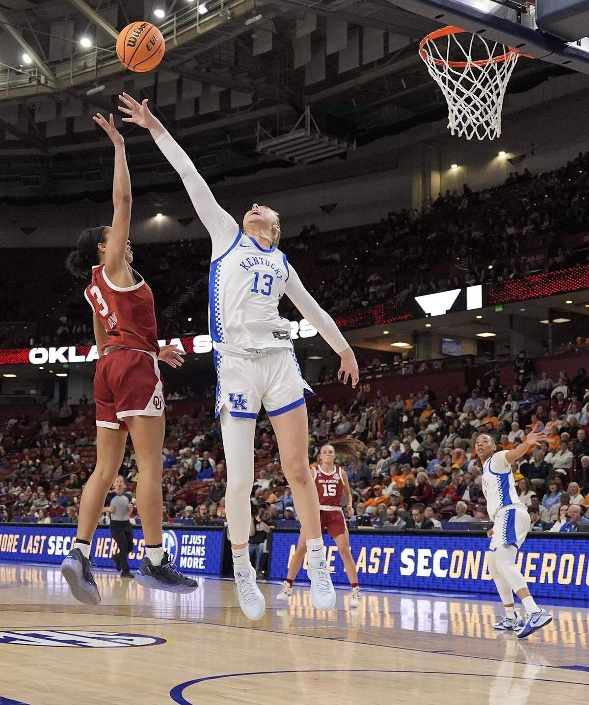 Kentucky’s Clara Strack (13) tries to block a shot by Oklahoma’s Zya Vann (3) during Friday’s game. Strack finished with 12 points and 16 rebounds but did not block a shot and committed six turnovers.