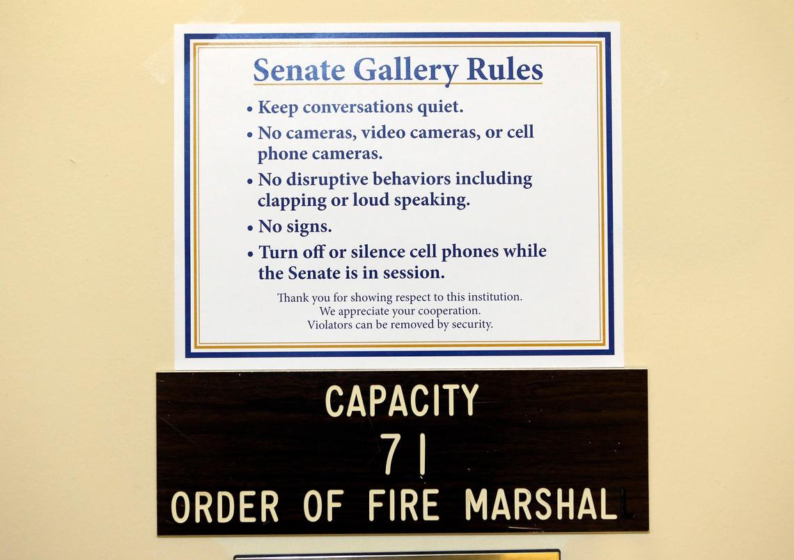 Signs are posted by the gallery in the Senate Chambers in the State Capitol in Frankfort, Ky. Republican Gov. Matt Bevin on Jan. 4 signed an emergency regulation outlining procedures for the state Finance and Administration Cabinet to implement to “protect the health, safety and welfare of visiting members of the public, as well as staff” in the two buildings and other state facilities and grounds.